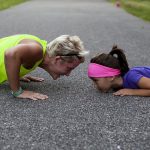 elder woman and girl doing push ups